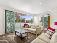Upstairs lounge room ... with queen bed in background